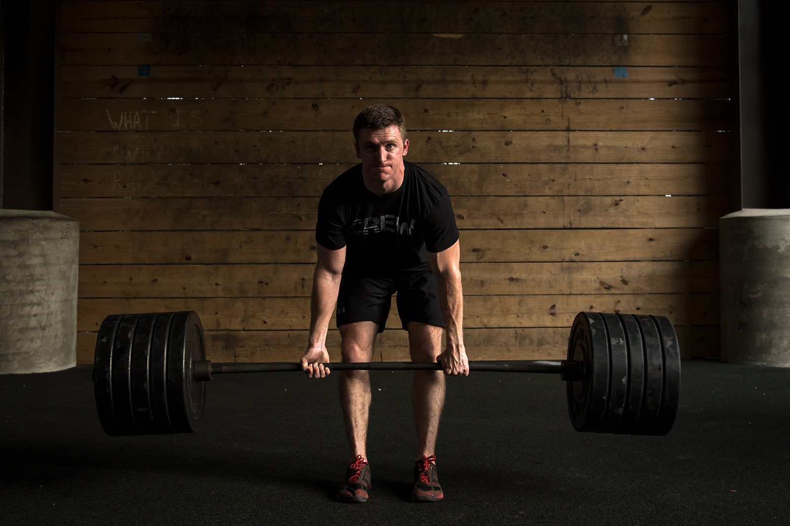 Jerred Moon, founder of Garage Gym Athlete, performing a heavy deadlift.