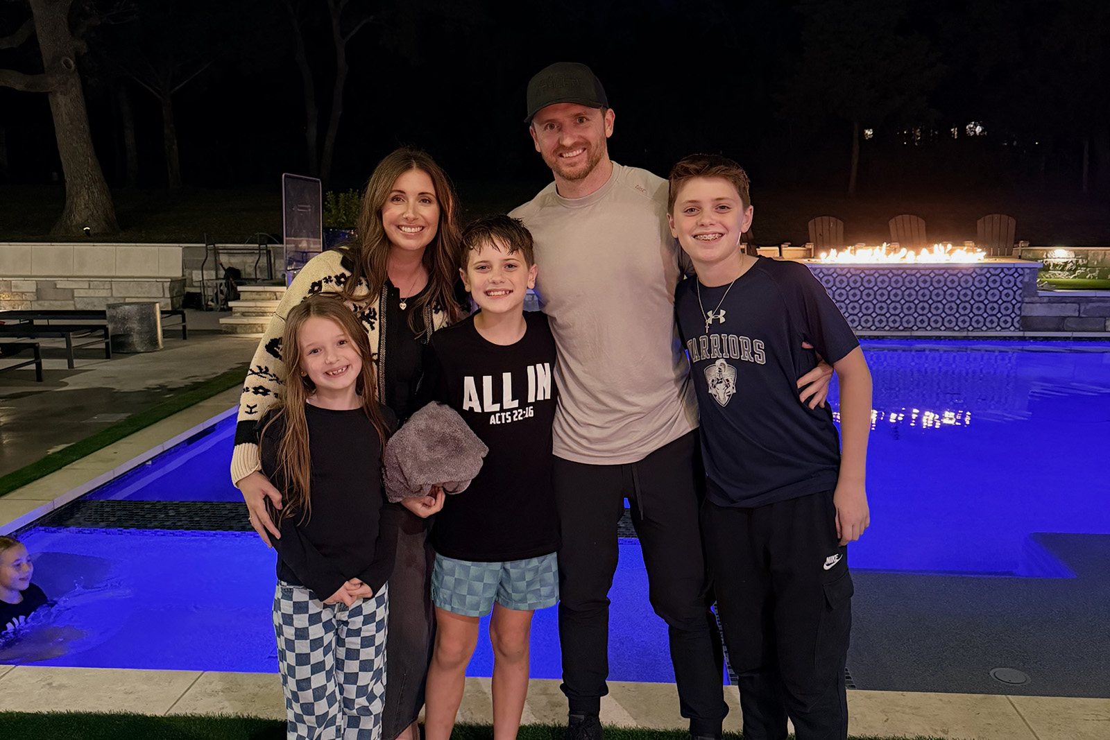Jerred Moon at home with his wife and their three children.